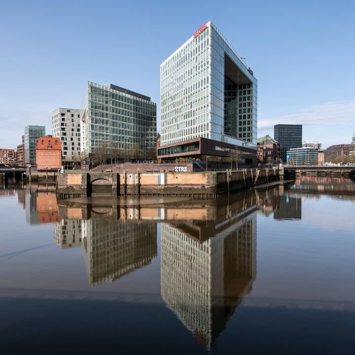Reflective modern buildings at Hamburg's waterfront create a stunning urban skyline.